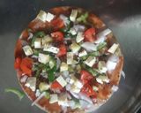 A picture of step 4 of Chapati pizza /thìn crust pizza.