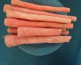 A picture of step 1 of Gajar ka halwa with coconut milk.