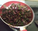 A picture of step 2 of Amaranth garlic fry.