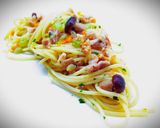 A picture of step 7 of Spaghetti with Rabbit Ragù, Mushrooms, and Walnuts.