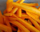 A picture of step 3 of Roast potatoes, carrots served with cabbage and kachumbari.