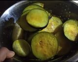 A picture of step 1 of Begun bhaja.