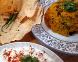 A picture of step 4 of Kathyawadi masala vegetable khichadi with masala curd, papad and 🌶.