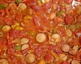 A picture of step 6 of Shakshuka with hot dogs.