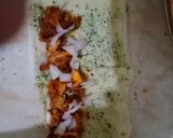 A picture of step 17 of Tandoori chicken rolls up.