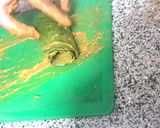 A picture of step 2 of Patra with Green Chutney.