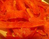 A picture of step 2 of Gajar ka halwa with peels.