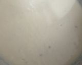 A picture of step 4 of Eggless mawa cup cake topping with shrikhand.