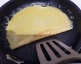 Une image de l'étape 8 de Tamagoyaki (omelette japonaise sucrée).