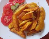 A picture of step 6 of Rosemary baked potato wedges.