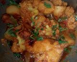 A picture of step 27 of Aloo fulcopi katla rosha ar misti doi.