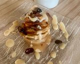 Une image de l'étape 5 de Pommes au four farcies à la banane jus au rhum toppings raisins secs et noisettes 🍎🍏.
