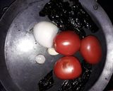 A picture of step 1 of Eggs in Pasilla Chile and Tomato Sauce.