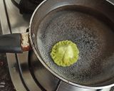 A picture of step 11 of Spinach Corn Ravioli in white sauce.