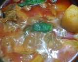 A picture of step 9 of Aloo Chicken Salan.