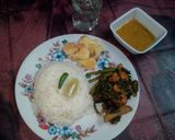 A picture of step 11 of Kumro shaak with chingri mach and dal a tasty lunch.