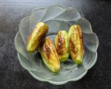 A picture of step 4 of Dudh Potol (Pointed gourd cooked in a milk gravy).