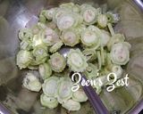 A picture of step 1 of White Bitter Gourd/Karela Fry.
