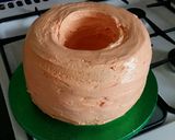 A picture of step 8 of Vickys Halloween Pumpkin Piñata Cake, Decorating Idea.