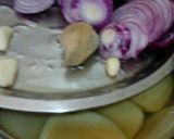 A picture of step 1 of Bengali goat meat curry with potato.