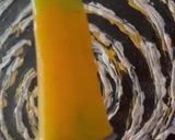 A picture of step 2 of Mango Banana Kiwi Popsicle.