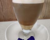 A picture of step 4 of Butterfly pea flower coffee latte.