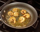 A picture of step 11 of Seared Steak and Shrimp with Sriracha Hollindaise and Roasted Tomatoes.