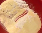 A picture of step 3 of Christmas cookies dipped in honey, aka melomakarona.