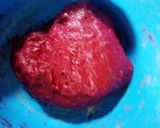 A picture of step 3 of Fried red velvet donuts.