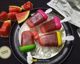 A picture of step 4 of Watermelon Ice Popsicles.