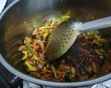 A picture of step 6 of Street style chicken chow mein.