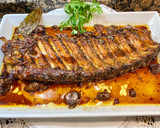 Foto del paso 9 de la receta: Costillar asado, al vino tinto, con hierbas aromáticas