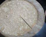 A picture of step 3 of Aloo paratha wrap.