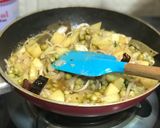 A picture of step 3 of Muri Ghonto: Bengali Yellow Rice with Fish Head.