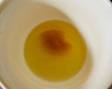 A picture of step 2 of Baked rolls under a cheese cap.