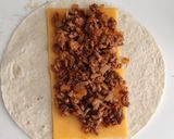 A picture of step 3 of Homemade Ground Beef and Cheddar Burrito.