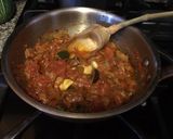 A picture of step 2 of Angel Hair Pasta Garlic, Tomatos and Achar Masala.