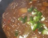 A picture of step 4 of Kibda (Egyptian liver sauce) and French fries.