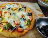 A picture of step 13 of Jain Cheese burst pizza.