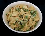 A picture of step 11 of Pappadelle Pasta with Asparagus, Saffron + Peas.