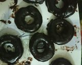 A picture of step 7 of Chocolate Donuts filled with custard.