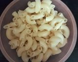 A picture of step 1 of MACARONI (Cheese Corn Macaroni pasta).
