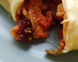 A picture of step 8 of Mexican chicken enchiladas.