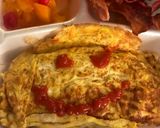 A picture of step 6 of Happy Face omurice.