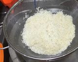 A picture of step 1 of Muri Ghonto: Bengali Yellow Rice with Fish Head.