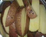 A picture of step 2 of Garlic buttery potato wedges.