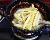 A picture of step 2 of Masala french fries.