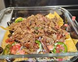 A picture of step 2 of 4 Cheese loaded nachos.