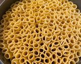 A picture of step 4 of Rigatoni pasta pie.