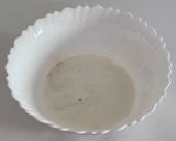 A picture of step 5 of Healthy Atta Jaggery Muffins in Appe Pan.